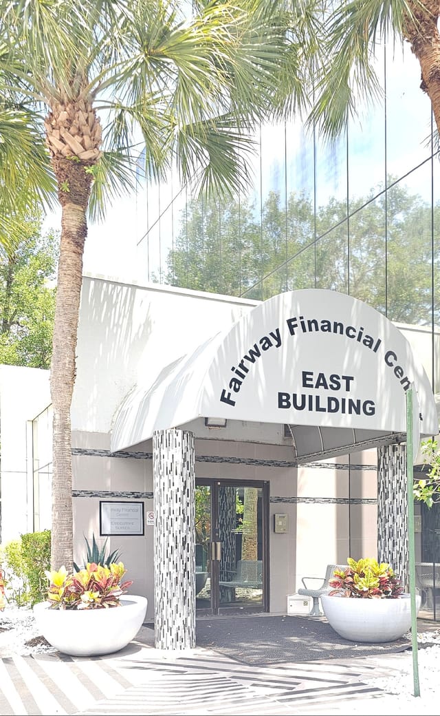 modern clinic exterior building, professional signage, palm trees, Florida architecture, welcoming entrance